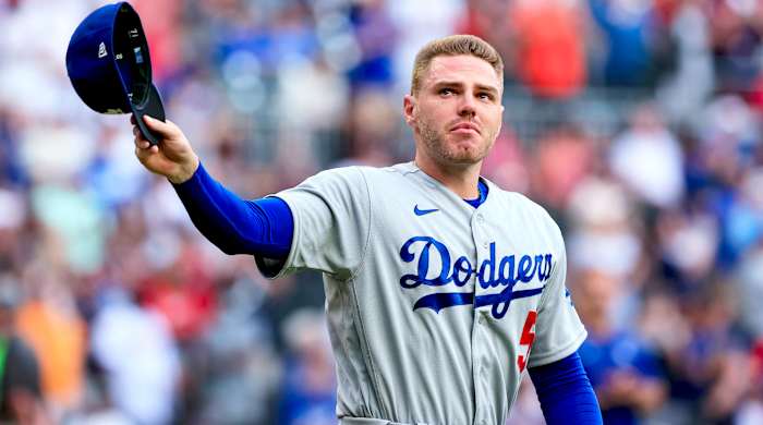 Los Angeles Dodgers first baseman Freddie Freeman walks to the field for the presentation of his World Series championship ring, before the team’s baseball game against the Atlanta Braves on Friday, June 24, 2022 in Atlanta.